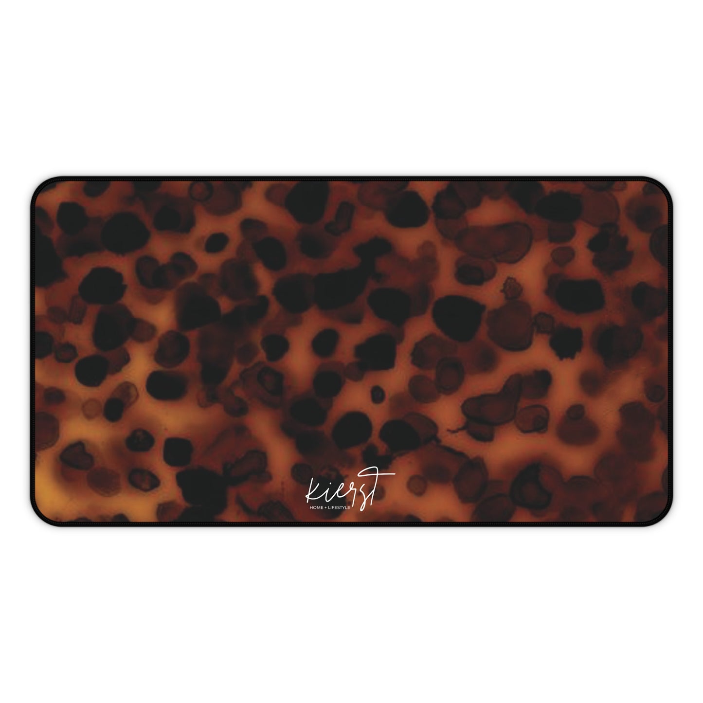Tortoiseshell print mat with 'kierst' branding on a white background