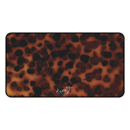 Tortoiseshell print mat with 'kierst' branding on a white background